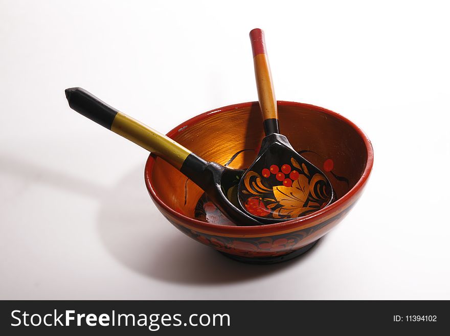 Russian traditional wooden plate and spoons in it. Russian traditional wooden plate and spoons in it.