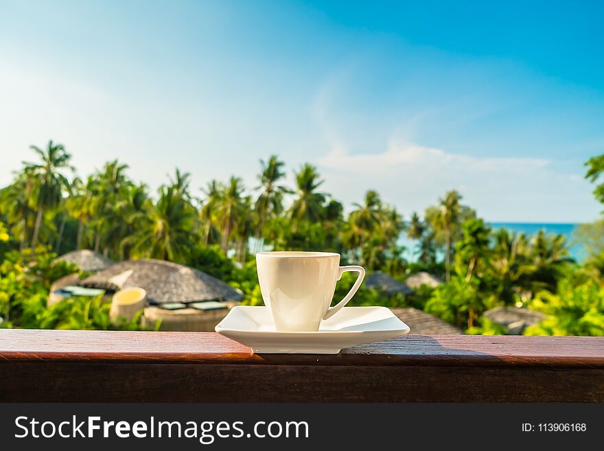 White coffee cup with beautiful paradise island sea and beach - Holiday Vacation and Travel concept