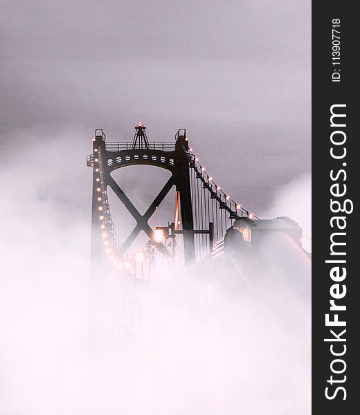 Suspension Bridge Covered With Fog