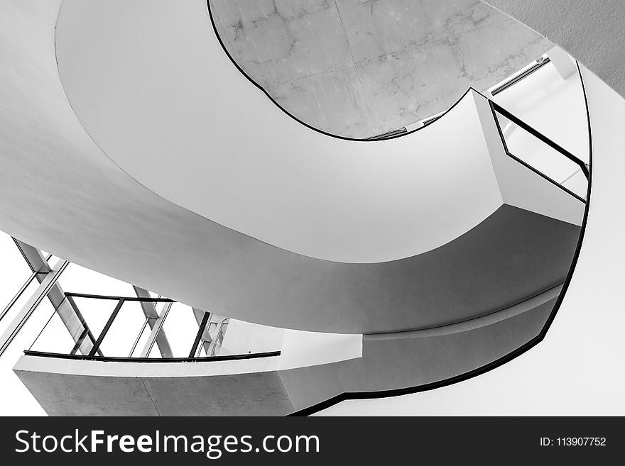 Grayscale Photo of Spiral Stairs