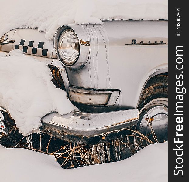 Close-Up Photography of Vintage Car Covered With Snow