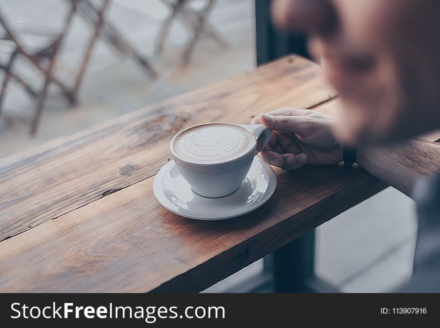 Person Holding White Mug Filled With Coffee