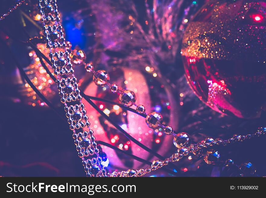 Decorated Christmas tree and colorful garland lights, filtered. Decorated Christmas tree and colorful garland lights, filtered.