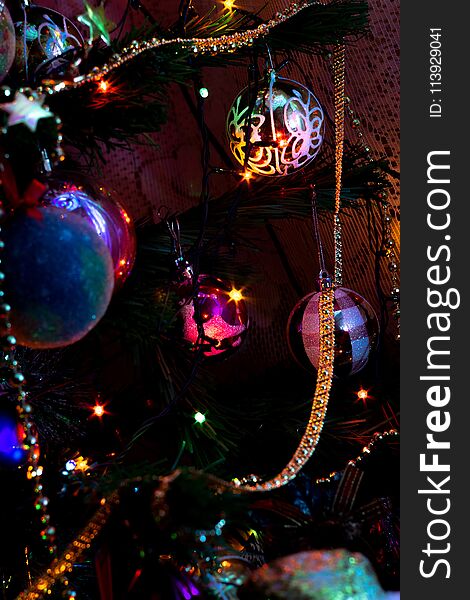 Decorated Christmas tree and colorful garland lights. Decorated Christmas tree and colorful garland lights.
