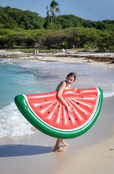 Beautiful Teenage Girl Having Fun At The Beach With An Inflatable Toy In The Caribbean Sea Royalty Free Stock Photos