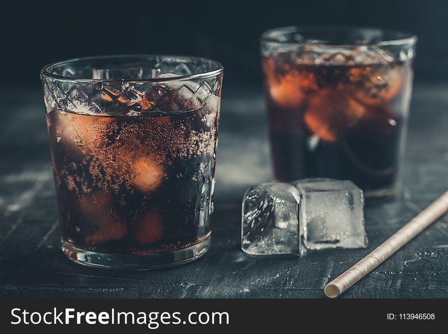 Rum and cola with ice. Cold cocktails for summer parties. Alcohol drinks.