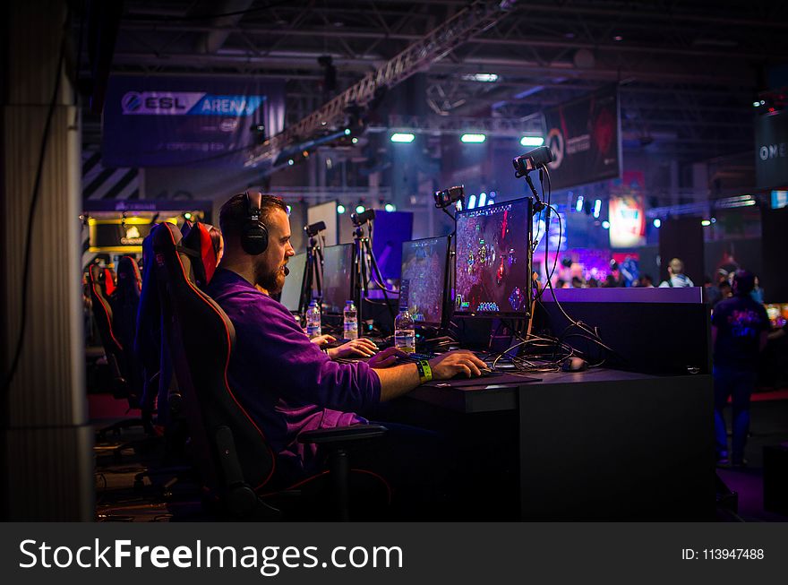 Man Playing Game On Personal Computer