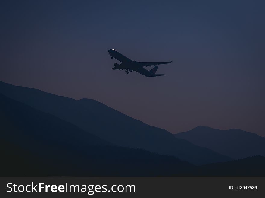 Silhouette of Airplane During Evening