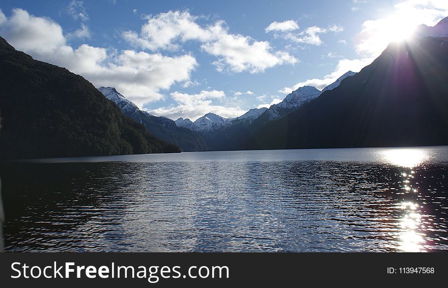 Landscape Photography of Mountain and Body of Water