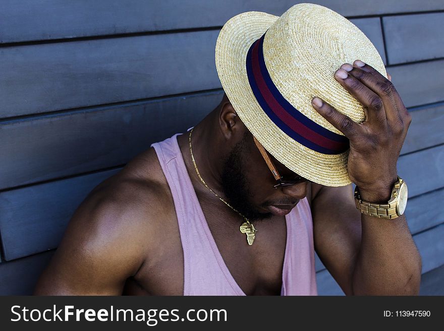 Man Wearing Purple Tank Top, Gold-colored Necklace, Gold-colored Watch, Sunglasses, and Beige Fedora Hat Outfit