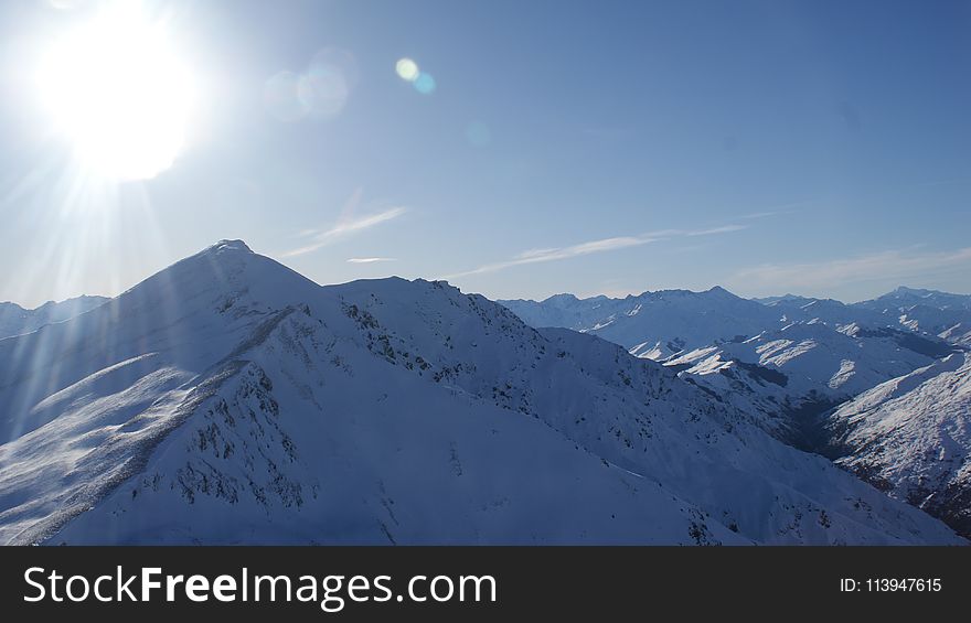 Snow Covered Mountain Under Gray and White Sky