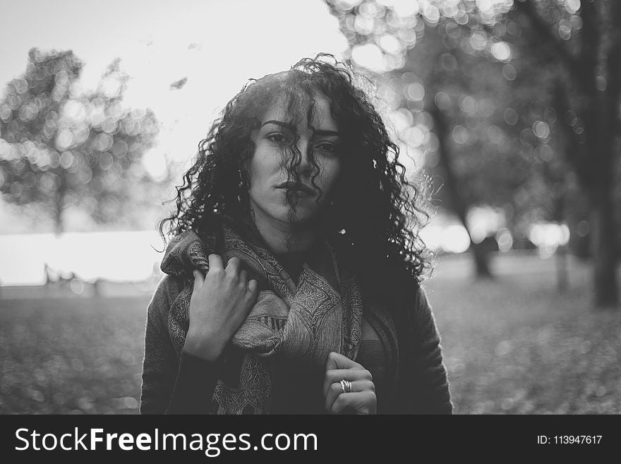 Grayscale Photo Of Woman Wearing Scarf