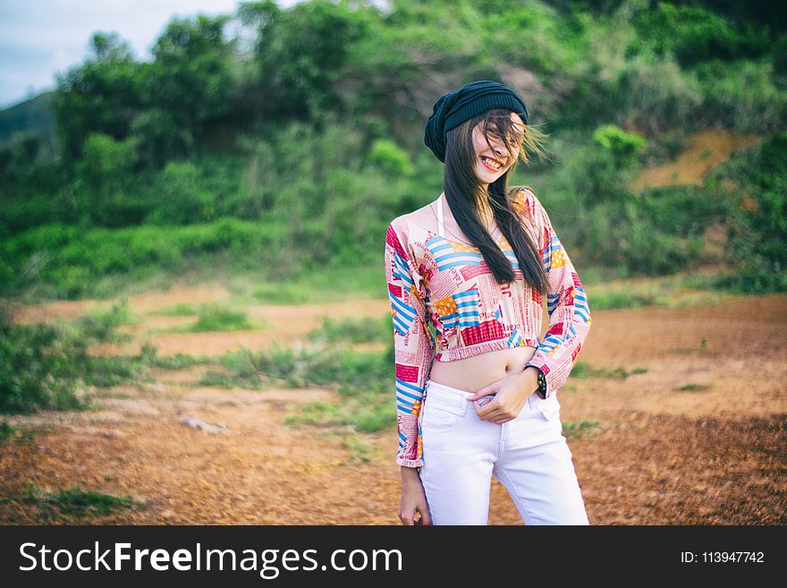 Photo of Woman Wearing Colorful Top