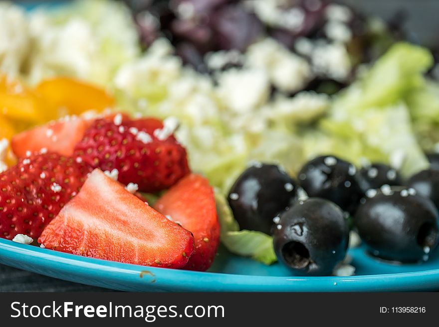 Shallow Focus Photography of Sliced Strawberries and Black Olives