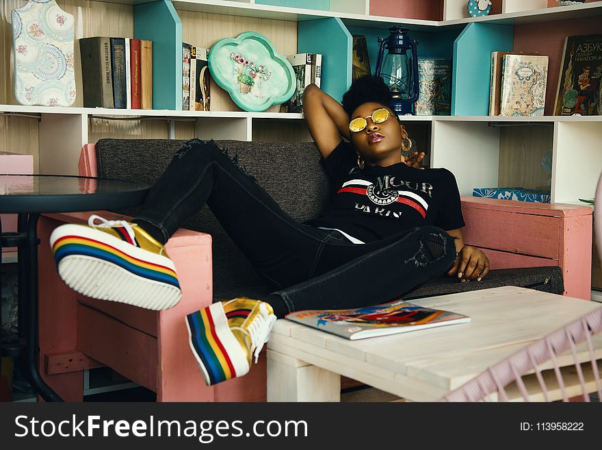 Photo of Woman Sitting on Couch
