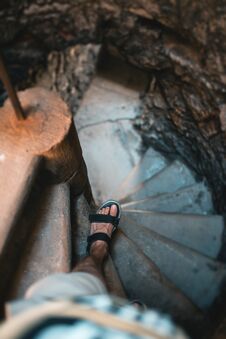 Man Goes Down The Stairs, Medieval Castle. Royalty Free Stock Photography Man Goes Down The Stairs, Medieval Castle. Royalty Free Stock Photography