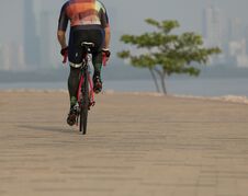 Cyclist Riding Bike On Seaside Royalty Free Stock Photos