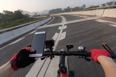 Cyclist Using Smartphone For Navigation Royalty Free Stock Photo