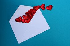 Big White Open Envelope With Red Hearts On A Blue Background Stock Photo