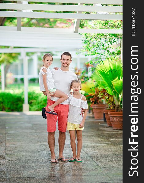 Father and kids on summer vacation walking together