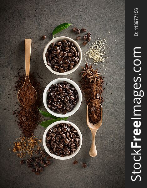 Different Varieties Of Coffee Beans With Sugar And Green Leaf On