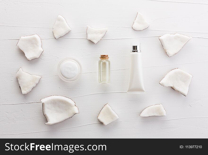 Homemade coconut products on white wooden table background from