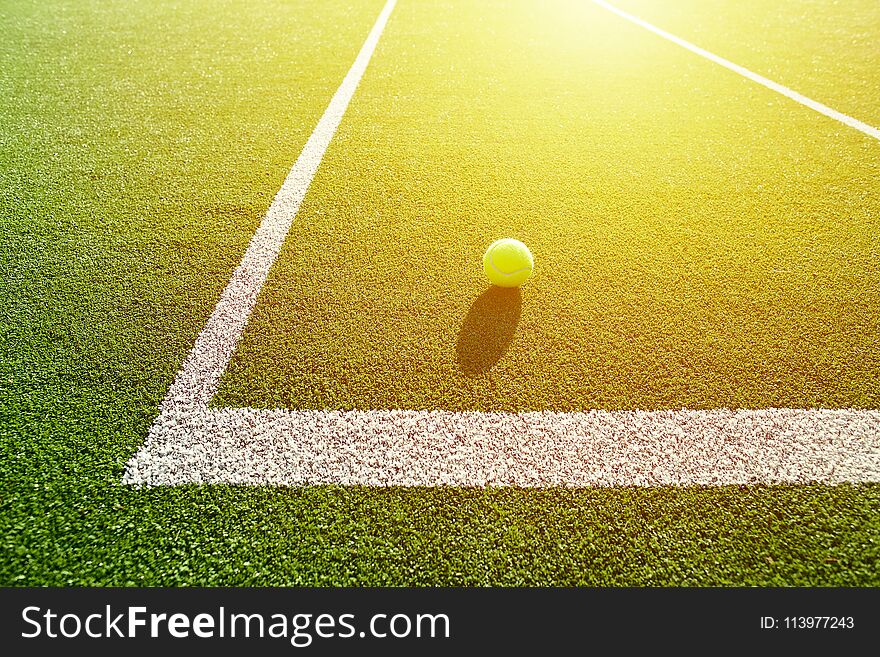 Soft Focus Of Tennis Ball On Tennis Grass Court Good For Background With Sun Light