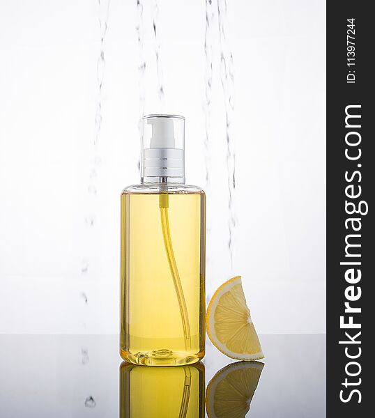 High Key Photography Liquid Jel Bottle And Lemon With Droplet In