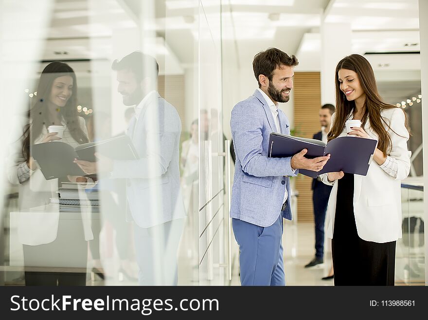 Young couple discussing about business in a modern office