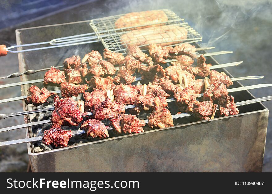 The Most Delicious Sausages, Appetizing Shish Kebab From Fresh Meat Shish Kebab , Grilled From Charcoal, Outdoors