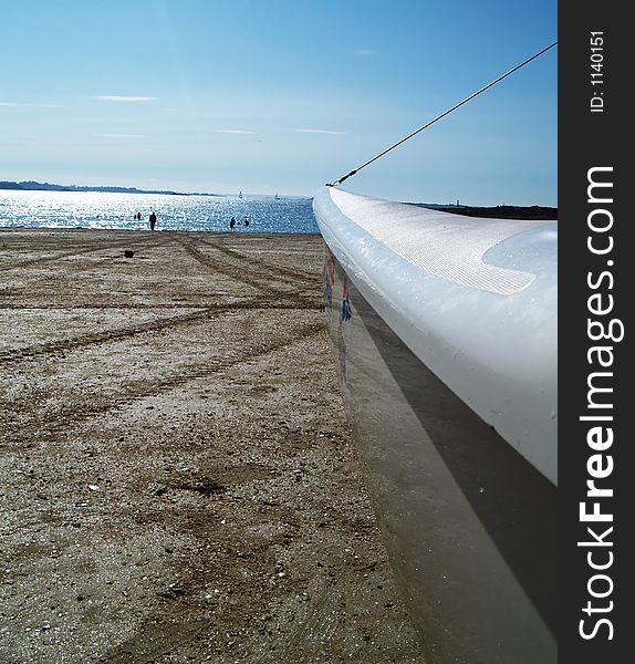 Detail of a catamaran lying on the beach