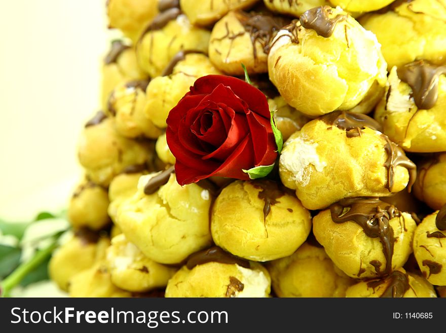 Puff cakes with red rose. Puff cakes with red rose