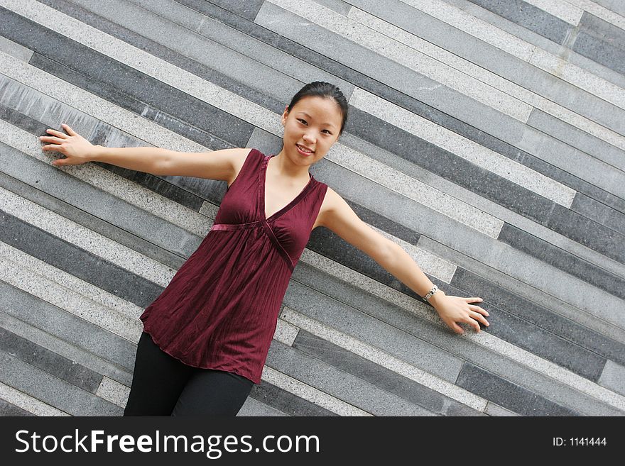 Pretty Korean woman with her arms stretched out. Pretty Korean woman with her arms stretched out