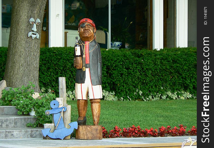 A carved wooden pirate statue that we discovered outside of a lake house while we were out boating.