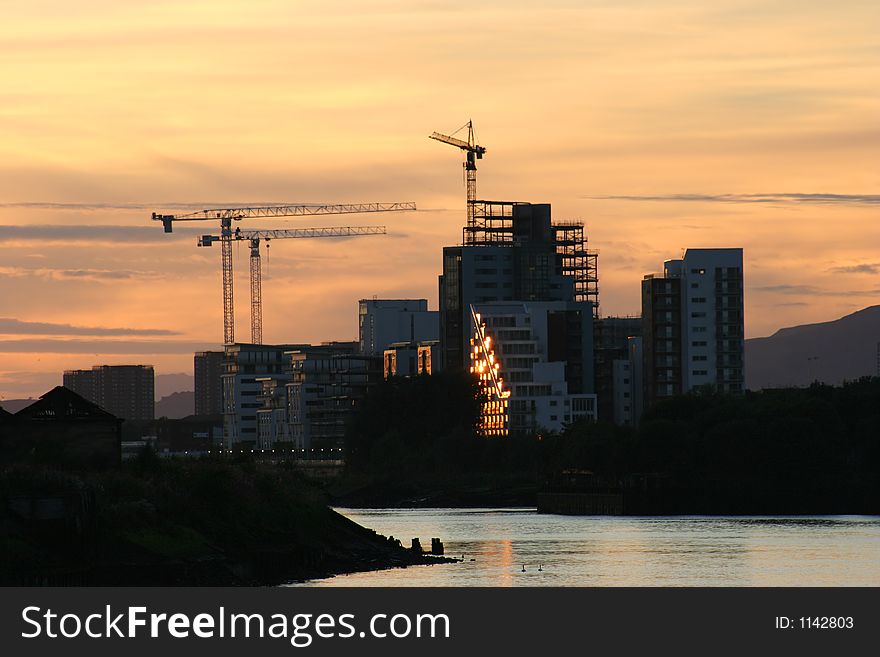 Cranes tower over new flats being built on the River Clyde