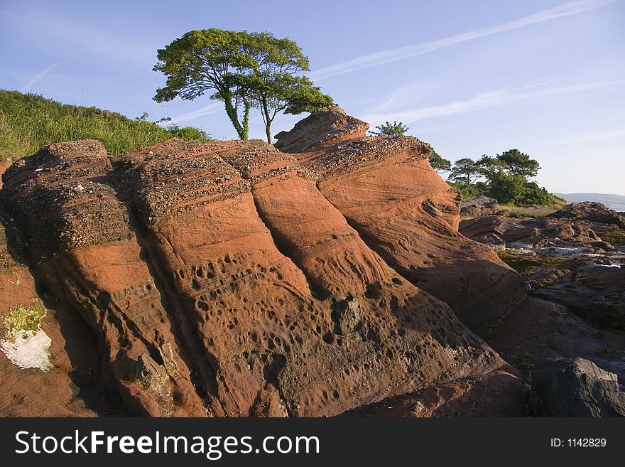 Beds of old red sandstone exposed on the eastern shore of Bute, Scotland. Beds of old red sandstone exposed on the eastern shore of Bute, Scotland