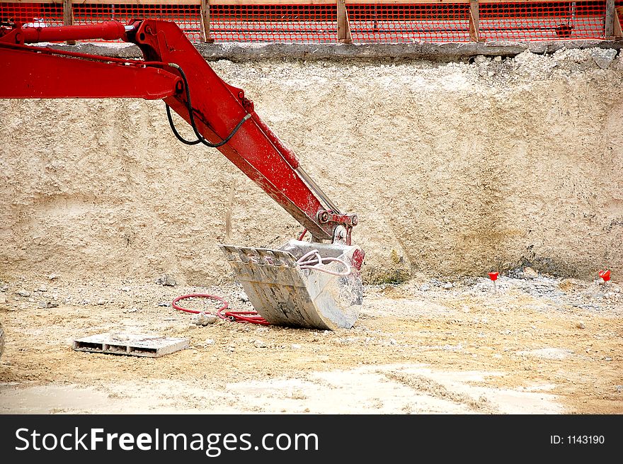 Diger shovel resting at construction site. Diger shovel resting at construction site