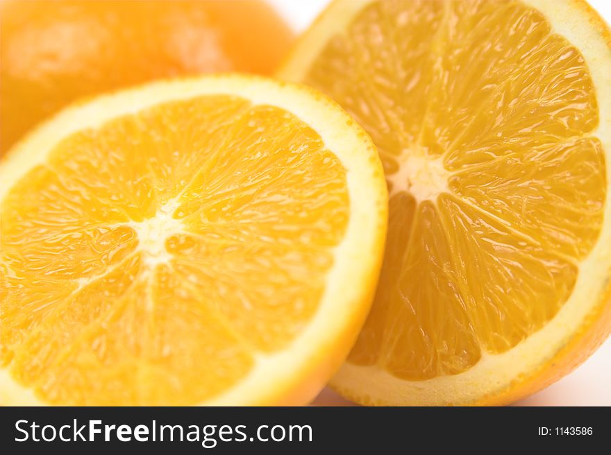 Orange halves wide isolated against white with copy space. Orange halves wide isolated against white with copy space