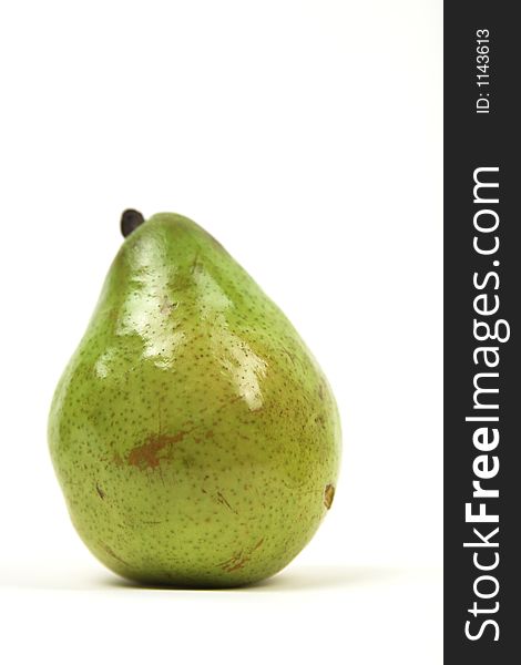 Single pear against white background, isolated with copy space. Single pear against white background, isolated with copy space