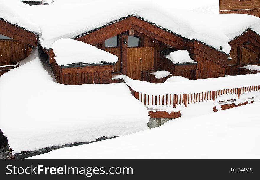 Chalet with snow on the roof Courchevel France