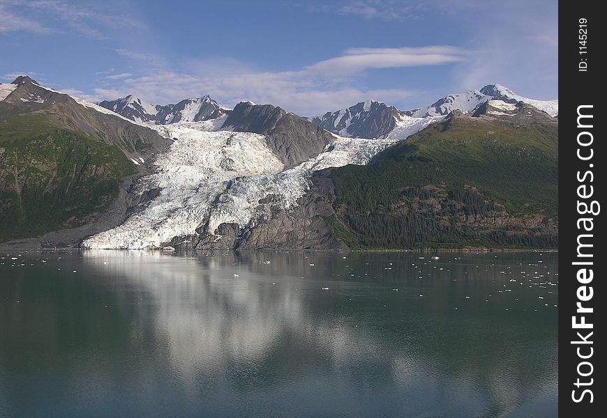 Morning view and reflection of College Glacier in fiord in Alaska. Morning view and reflection of College Glacier in fiord in Alaska