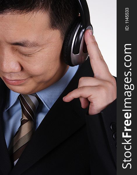 Asian businessman listening