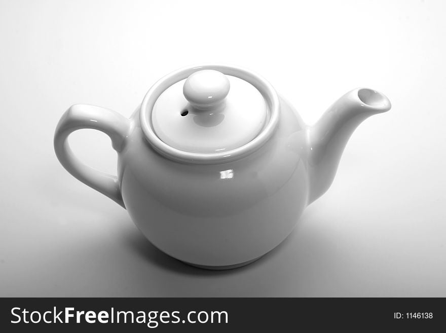 Isolated white teapot for tea or hot water.