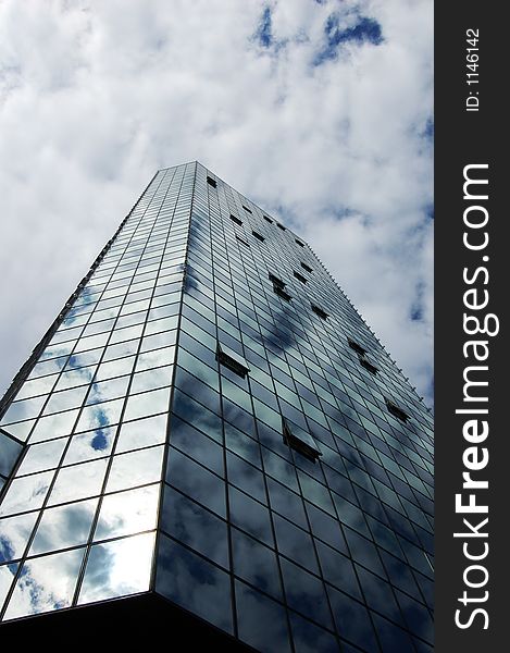 An office tower and cloudy sky