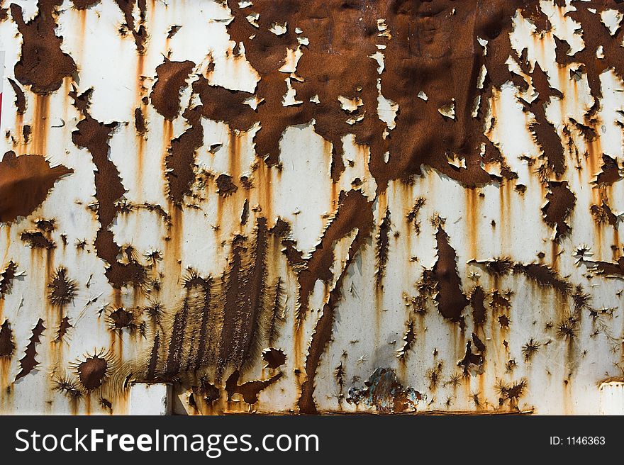 Rusted side of a steel container. Rusted side of a steel container