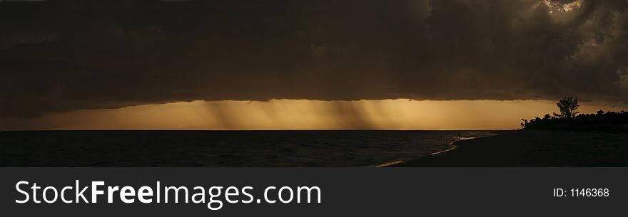 A panorama of a storm over the beach at Sanibel Island, Florida. A panorama of a storm over the beach at Sanibel Island, Florida