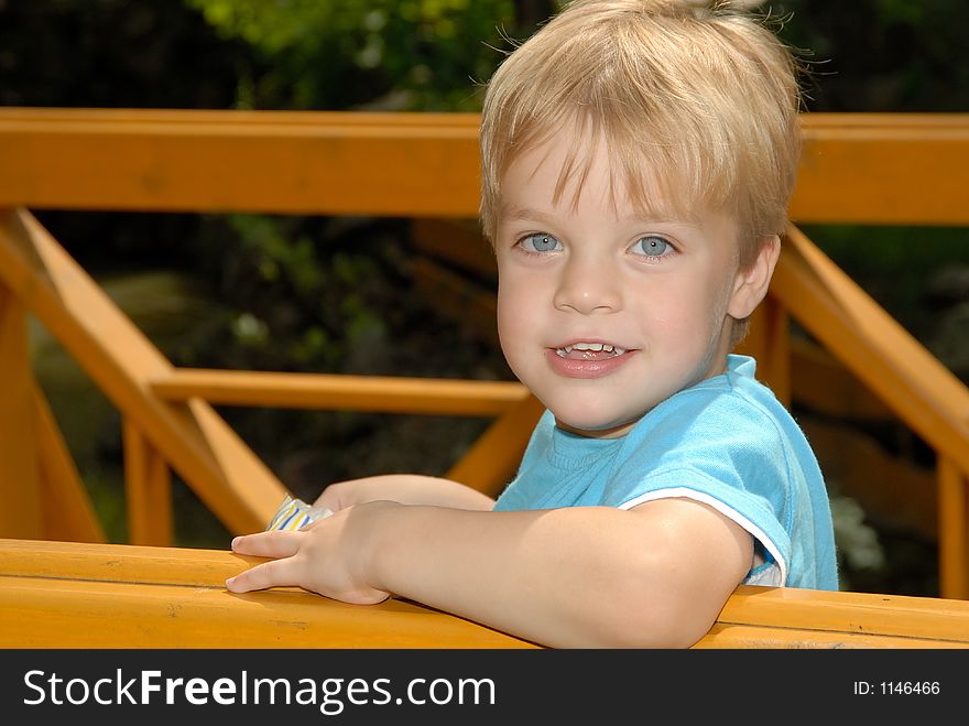 Young child portrait photographed outdoors. Young child portrait photographed outdoors