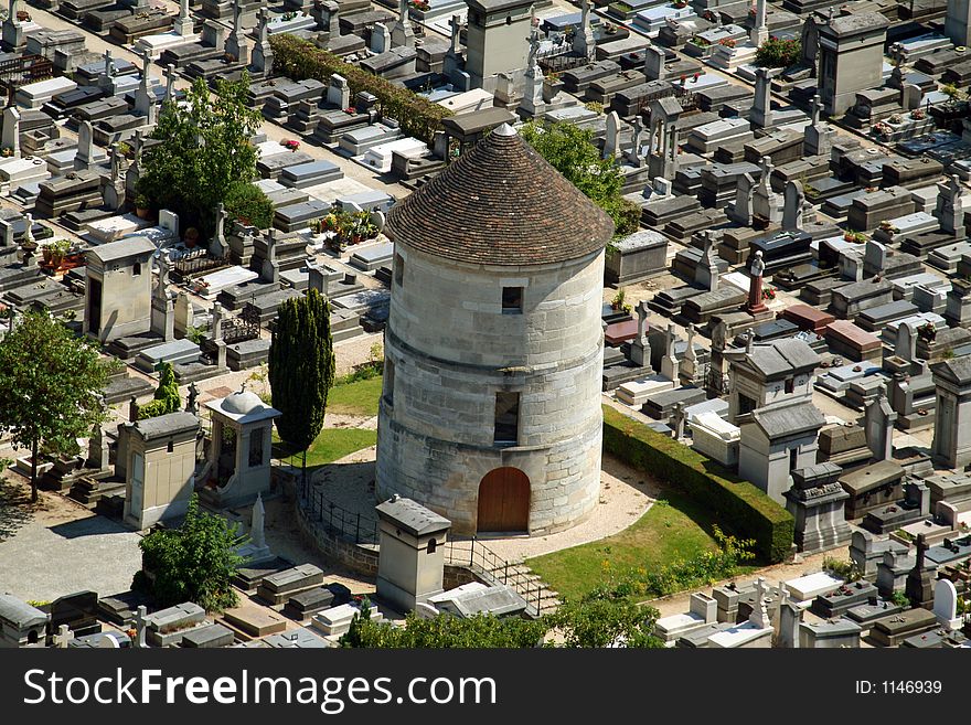 Cemetary with a tower in the middle