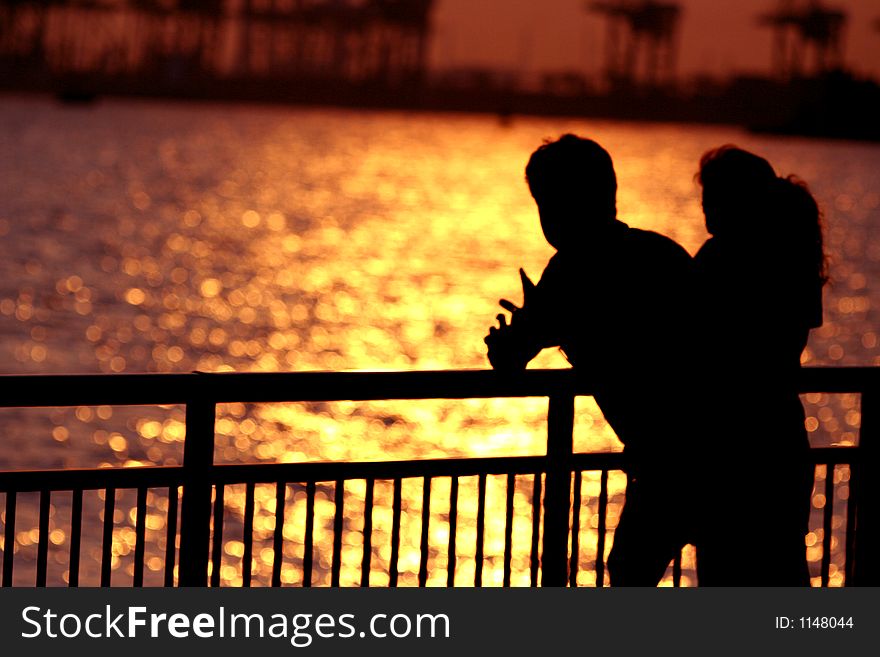 Silhouette of a loving couple at dusk.