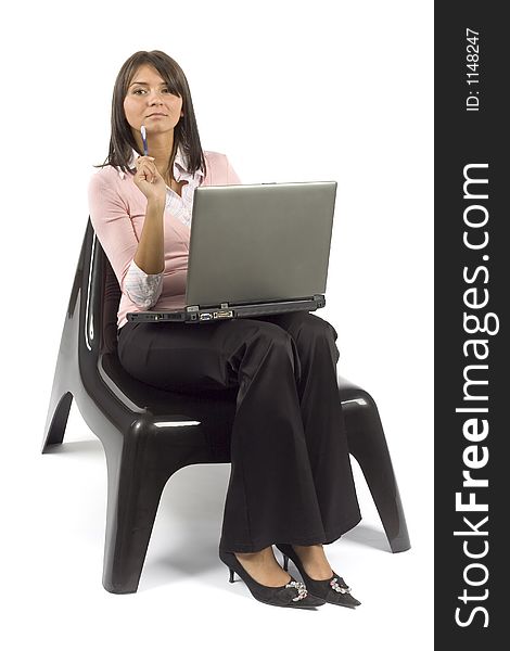 Isolated woman sitting; working computer
